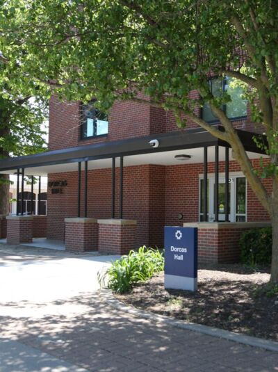 Dorcas Hall exterior, centrally located near the sand volleyball court and Janzow Campus Center