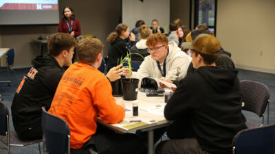 Ag summit attendees conducting a science experiment