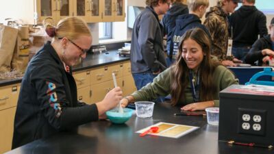 Ag summit attendees conducting a science experiment