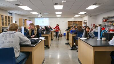Ag summit attendees conducting a science experiment