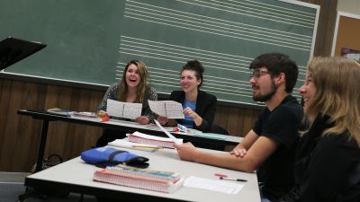Four music education majors participate in a class discussion.