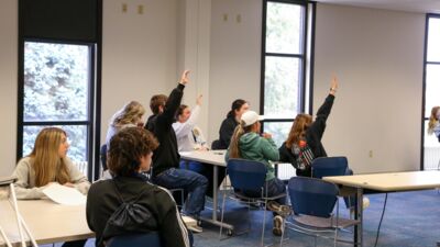 An AG professor going over a diagram of a cow